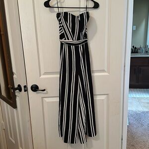 Black and white vertical striped strapless jumpsuit